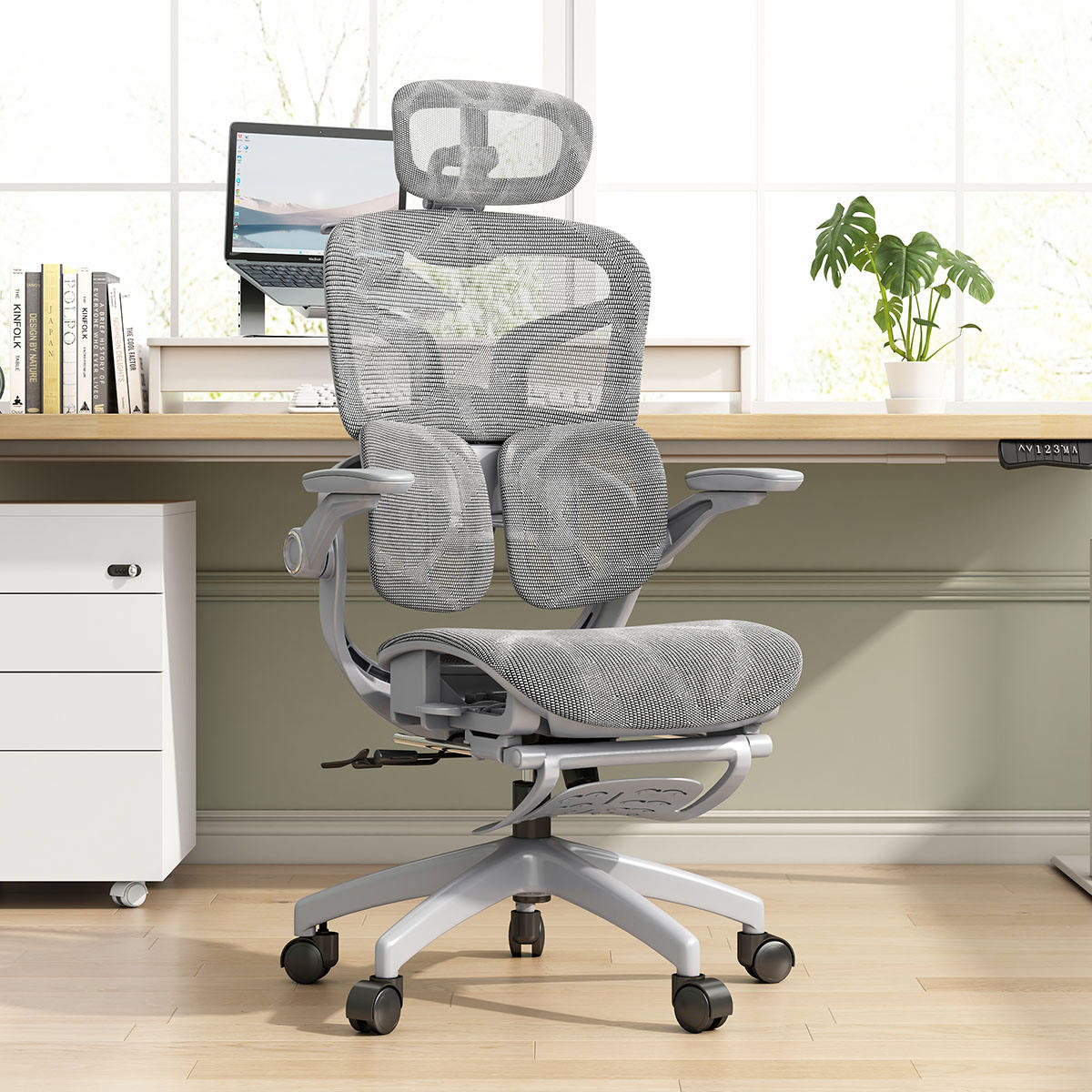 Gray ergonomic office chair in a home office setting with a desk and computer.